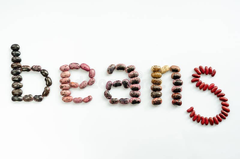 Word beans laid out to from colourful beans on white background. Healthy food concept. Top view royalty free stock photos Word beans laid out to from colourful beans on white background. Healthy food concept. Top view royalty free stock photos