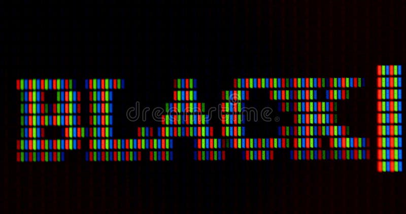 The word black is written in pixel letters on the monitor. RGB font rendering.