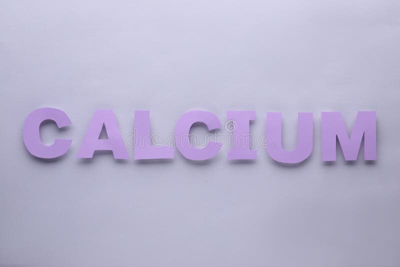 Word Calcium Made of Purple Letters on Light Grey Background, Flat Lay