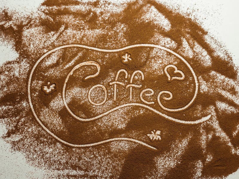 Word Coffee Handwrite in Coffee Powder on White Textured Background