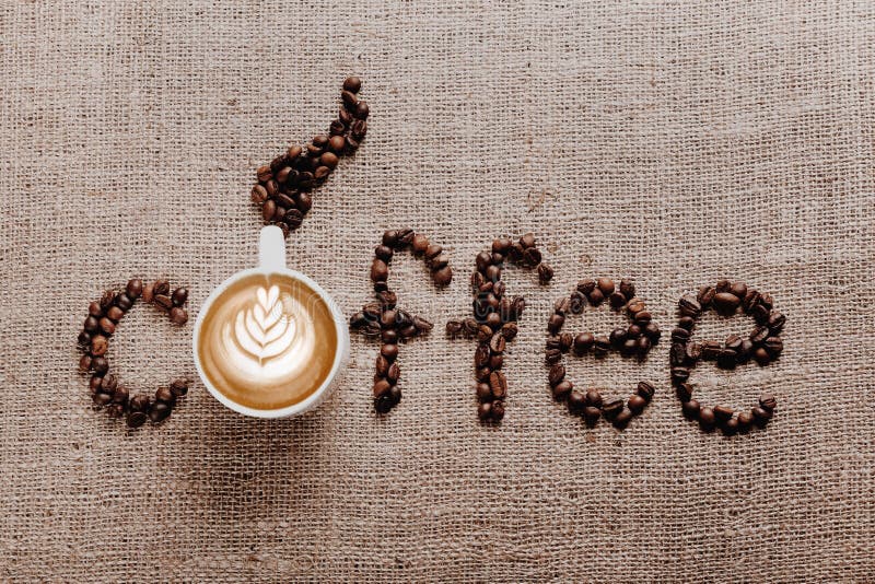 The Word Coffee Written from Coffee Beans on a Burlap Background, Top