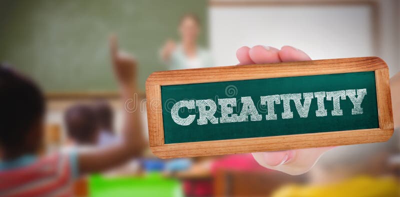 Creativity against pupils raising their hands during class stock image