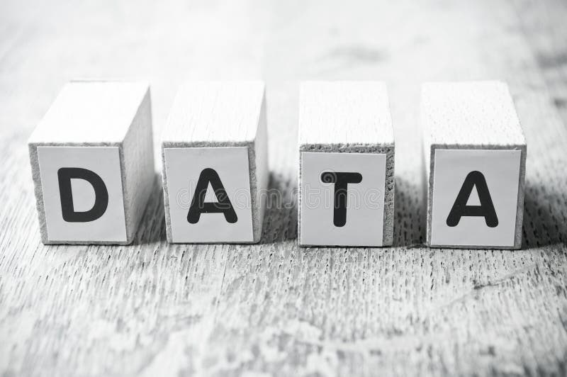 Word forming with cube on wooden desk - Data royalty free stock photos