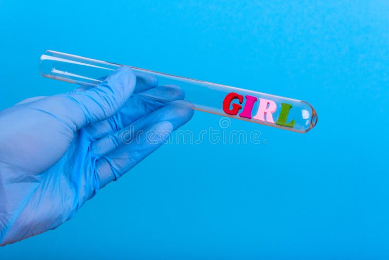 Word girl in test-tube holding a gloved hand