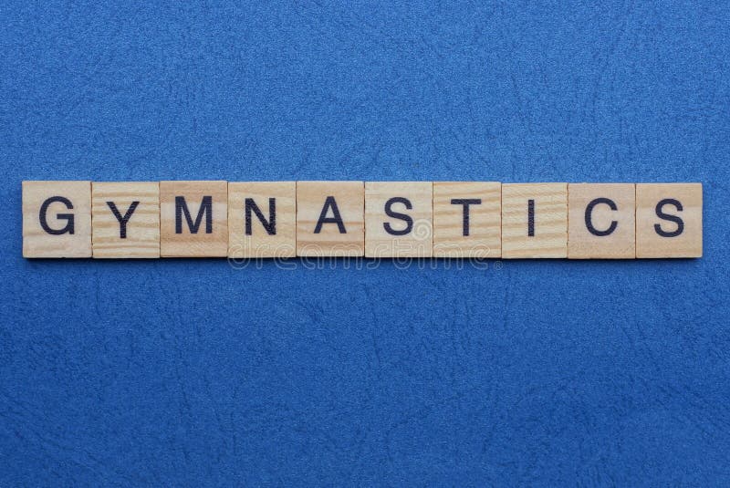 Word gymnastics from small gray wooden letters lies on a blue background