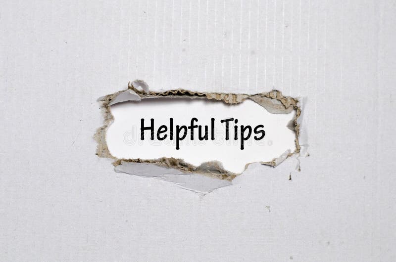 The word helpful tips appearing behind torn paper