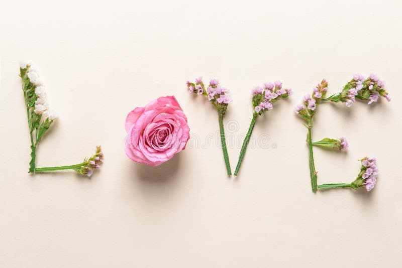 Word LOVE Made Of Beautiful Flowers On Light Background Stock Photo