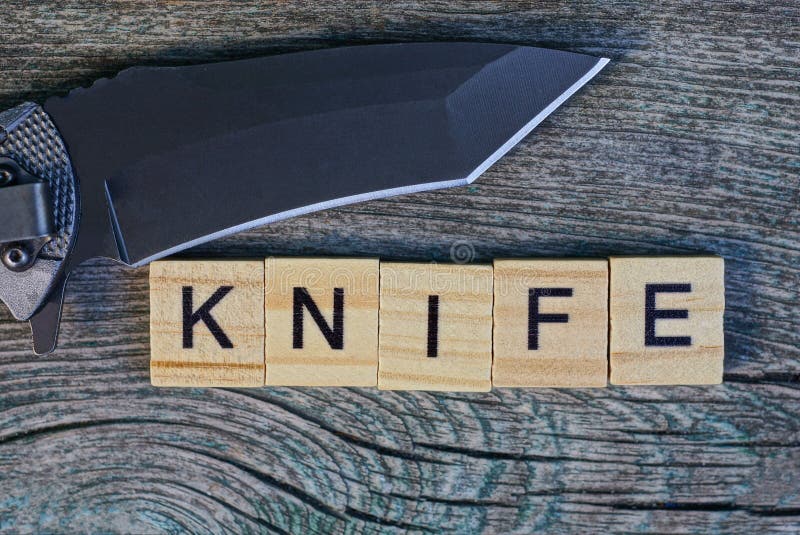 Word Made of Wooden Letters and Black Knife Stock Image Image of