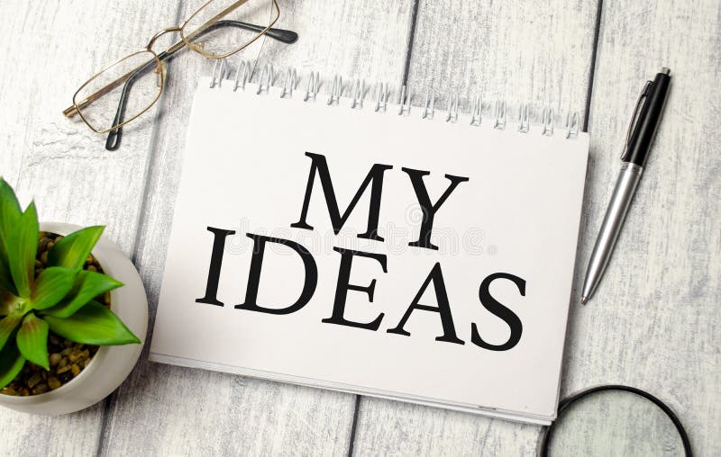 Word My Ideas on White Notebook with Office Supplies Stock Image