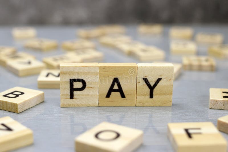 Word pay made of wooden letters royalty free stock photo