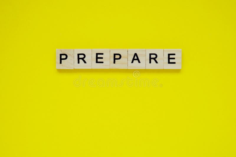 Word Prepare Top View Of Wooden Blocks With Letters On Yellow Surface word-prepare-top-view-of-wooden-blocks-with-letters-on-yellow-surface