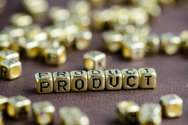 Word PRODUCT made from small golden letters on the brown background, selective focus. Business concept background