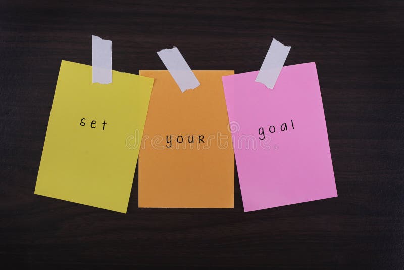 Word quotes of set your goal on sticky color papers royalty free stock photos