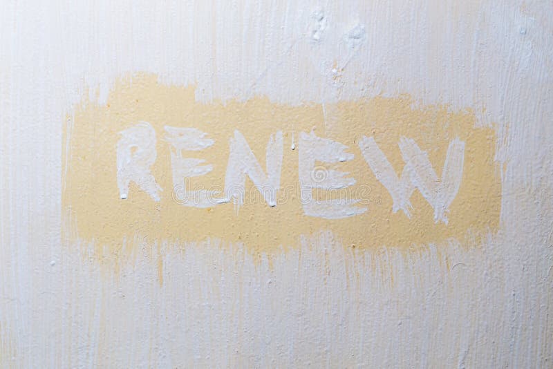 The Word Renew Written with Fresh Paint Over Old Flat Painted Surface