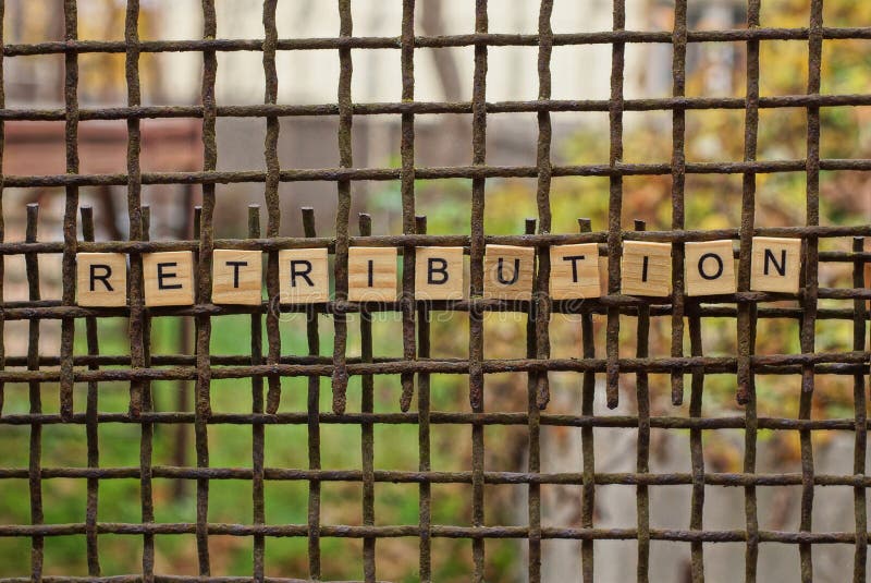 word retribution made of wooden letters