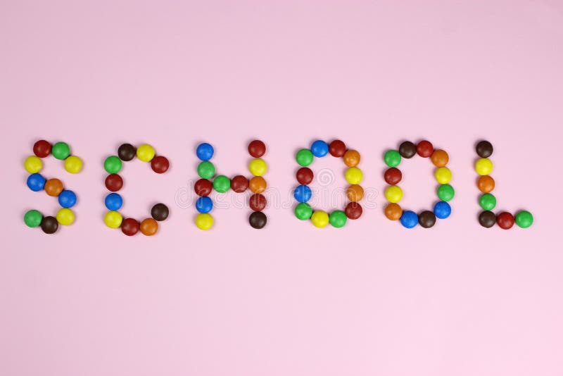 Word School of Colored Candies on a Pink Background Stock Image - Image of  kids, crossing: 171877965