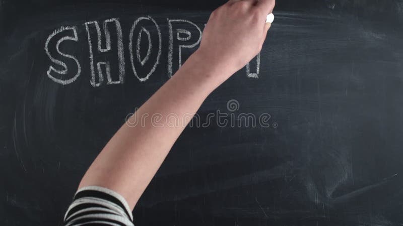 Word shopping is written in large letters chalk on chalkboard along with a shopping bag, a discount sign and the word