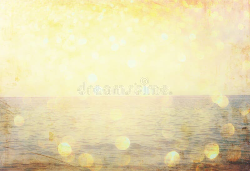 The word summer written on beach sand and gliiter golden lights. stock photos The word summer written on beach sand and gliiter golden lights. stock photos