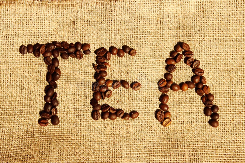 Word `Tea` Written in Coffee Beans Over Bagging Background. Coffee