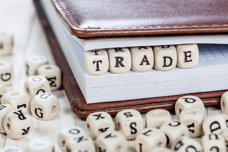 Word TRADE on Old Wooden Table. Stock Image Image of communication