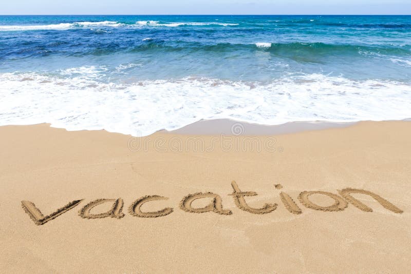 word vacation written on beach near sea stock image vacation word