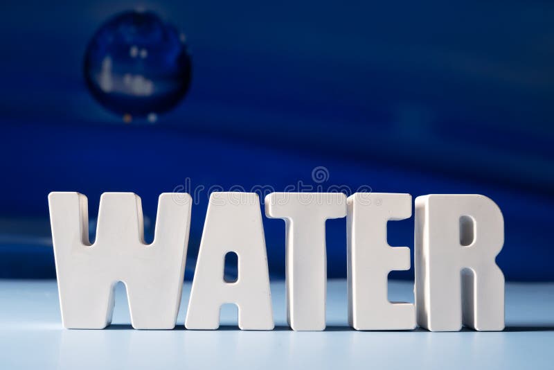Word Water Made from White Concrete Letters on the Blue Background
