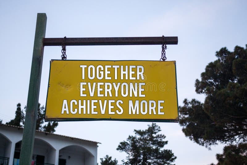 Word writing text Together Everyone Achieves More. Business concept for Teamwork Cooperation Attain Acquire Success Wooden board hang hanging post ideas messages feelings trees blue sky