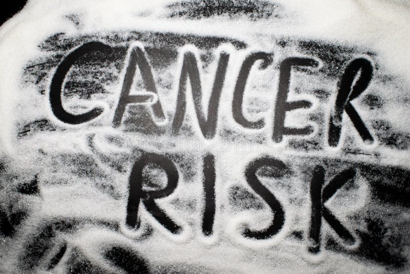 Words cancer risk written with and in sugar, health concern concept stock images Words cancer risk written with and in sugar, health concern concept stock images