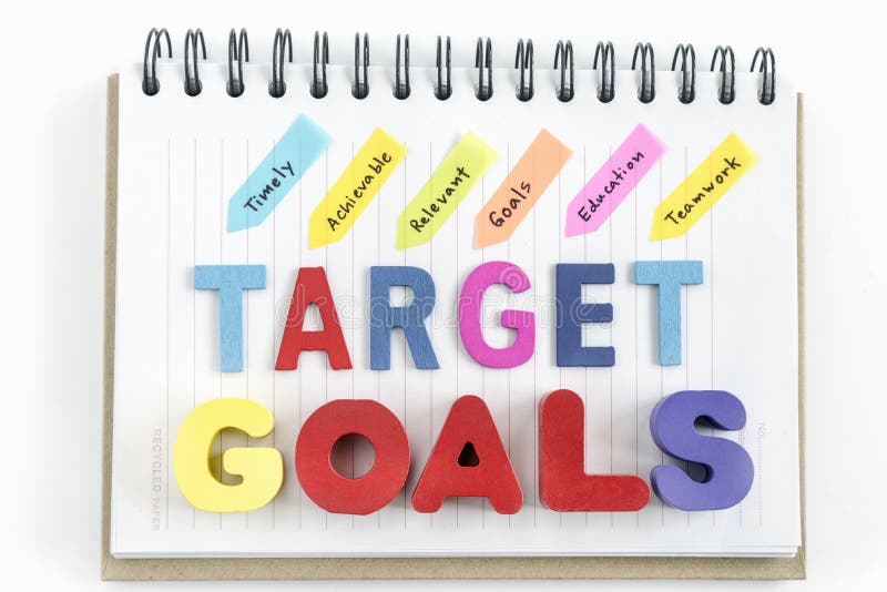 Words goals target on notebook over white background stock images Words goals target on notebook over white background stock images