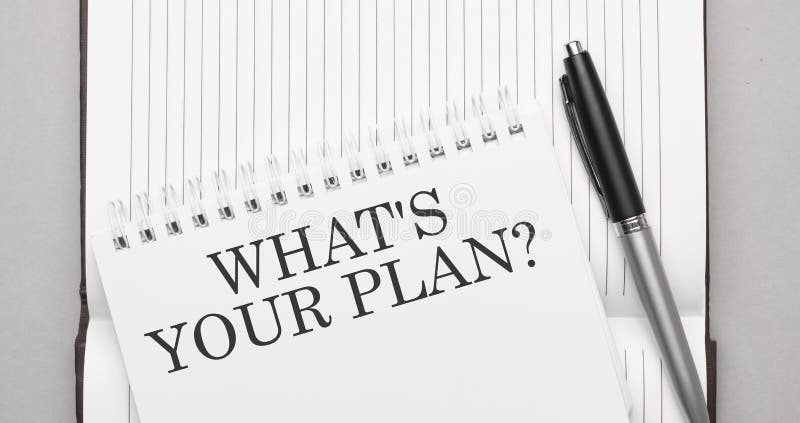 Words what's your plan text on notepad and pen stock photography