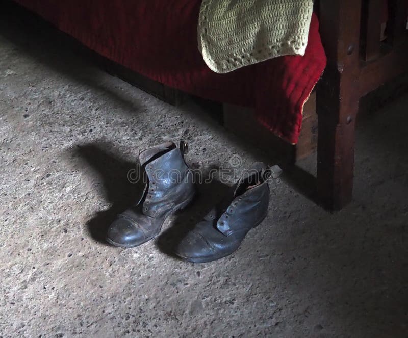 Work Boots beside Bed stock photo. Image of village, laces 81436090