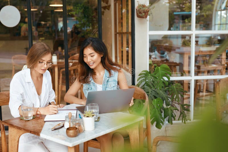 Work At Cafe. Women With Laptop Working Remotely On Summer Vacation At Tropical Country. Digital Nomad Lifestyle stock image