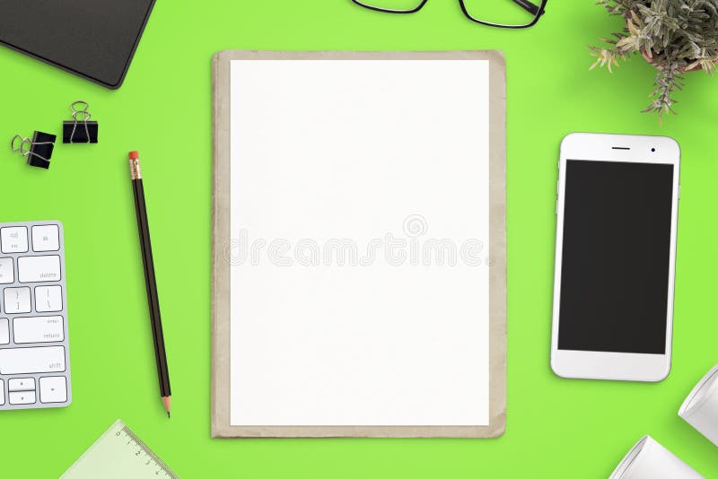 Work desk with empty paper on folder for sketch mockup. Smart phone mockup beside. Top view, flat lay