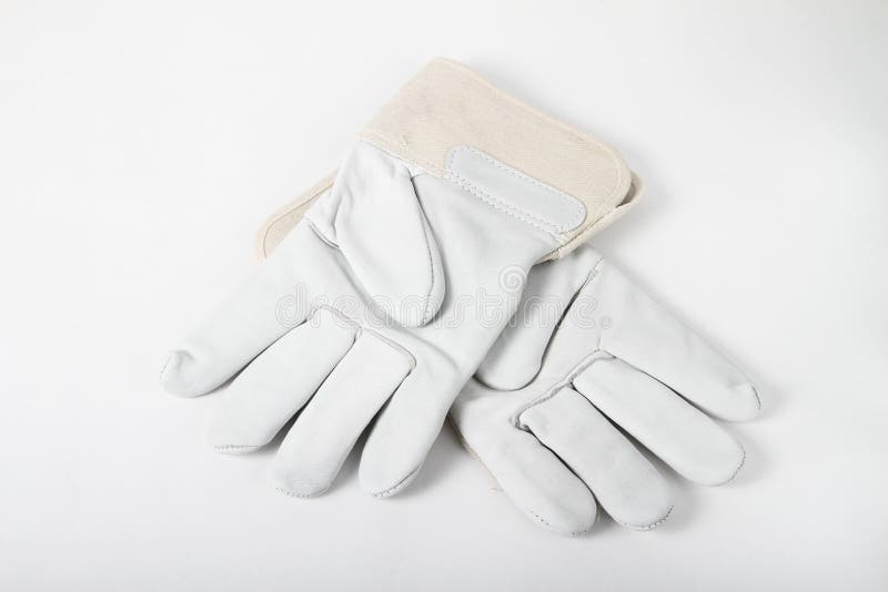 A new pair of work gloves on a white background. Pair working gloves stock images, royalty-free photos and pictures
