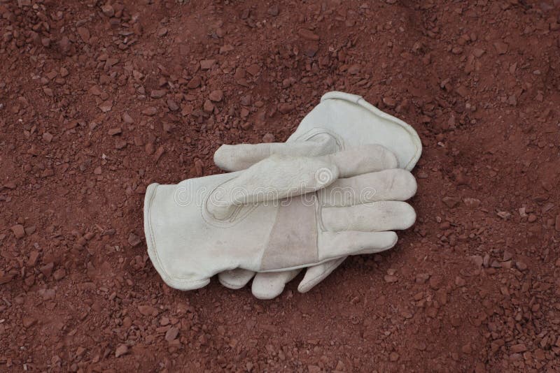 Work gloves in the crusher fines