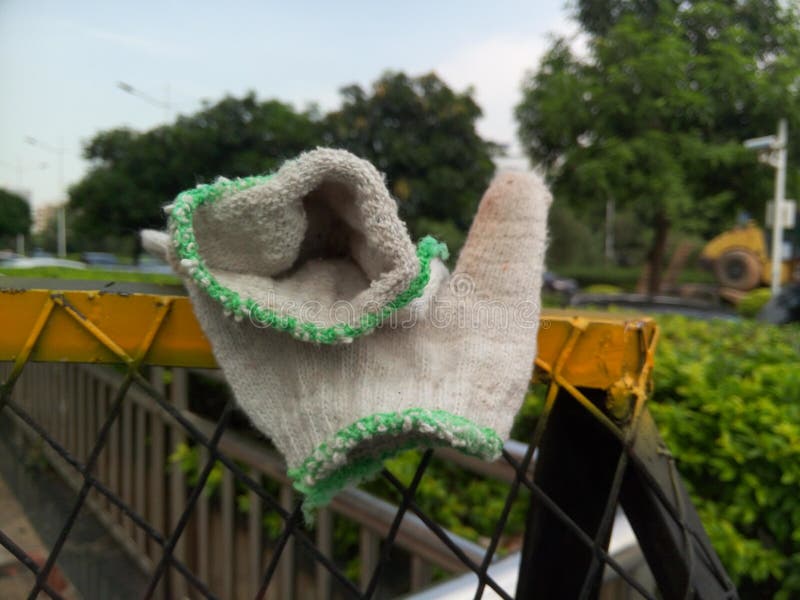 A pair of working gloves were placed at the labor scene. Pair working gloves stock images, royalty-free photos and pictures