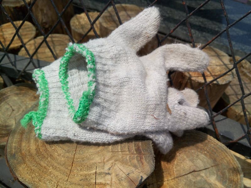 A pair of working gloves were placed at the labor scene. Pair working gloves stock images, royalty-free photos and pictures