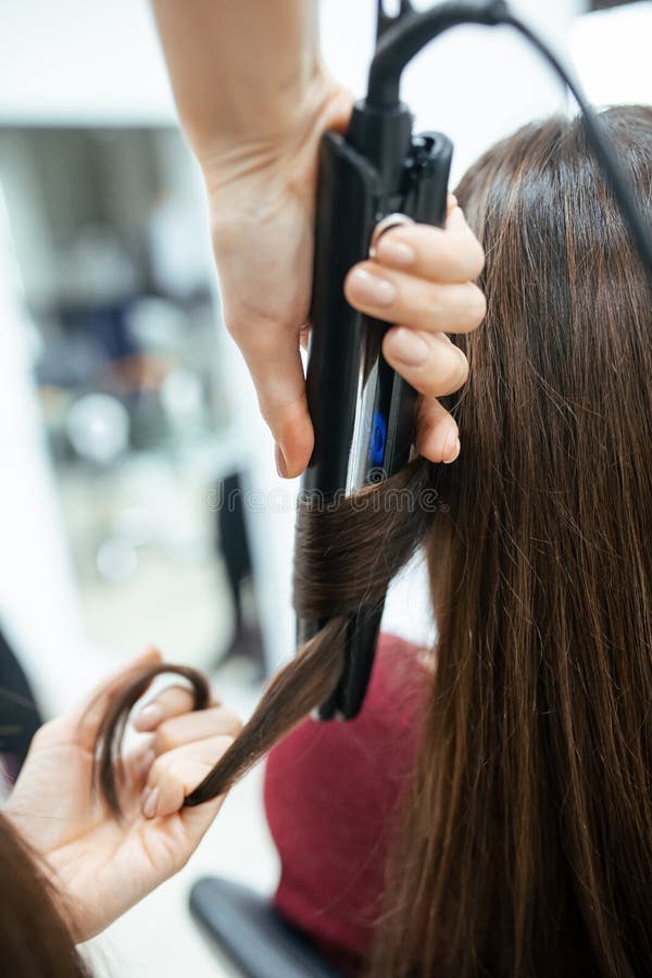 The Work of a Hairdresser. the Master Does Styling Hair and Curling with Tongs. Close-up of Hands and Tool Stock Image - Image of long, client: 179822983 The Work of a Hairdresser. the Master Does Styling Hair and Curling with Tongs. Close-up of Hands and Tool Stock Image - Image of long, client: 179822983