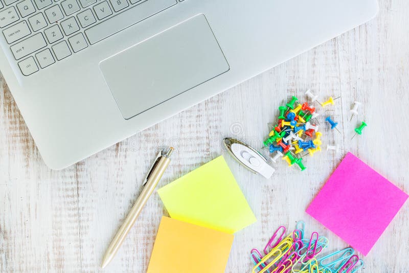 Work from Home Desk with Computer Laptop and Office Supplies Stock