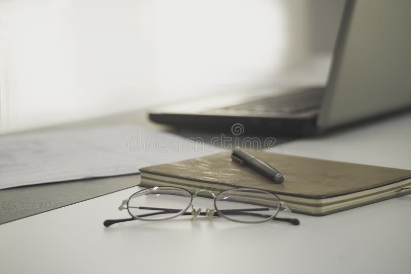 Work from Home, a Glasses Above Laptop Computer on a White Modern