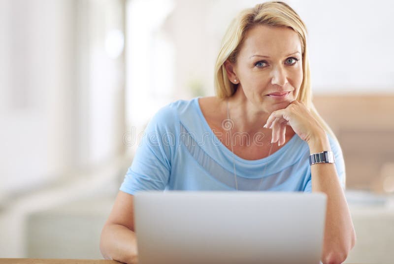 Work from home, portrait and mature woman with laptop for research, online and editing with smile. Freelancer, female editor and thinking with digital for article, news story and info for publication. Editing project stock images, royalty-free photos and pictures