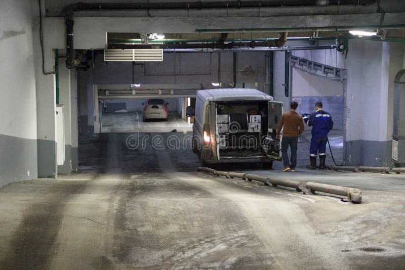 Work of industrial clean of sewage, plumbing on the basis of the car in the building. Two men, special vehicl