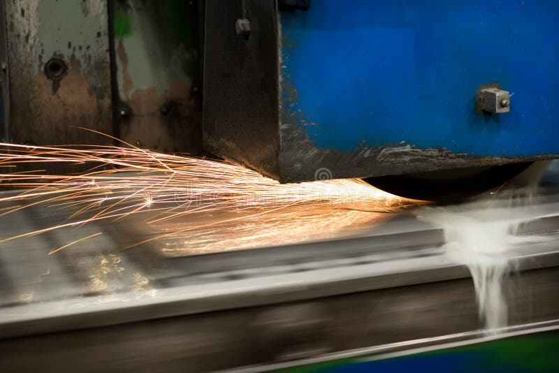 Work of an Industrial Surface Grinding Machine. Grinding of a Flat