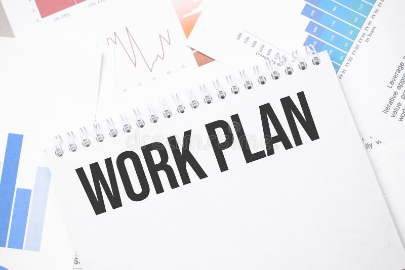 Work plan text on paper on the chart background with pen stock photos