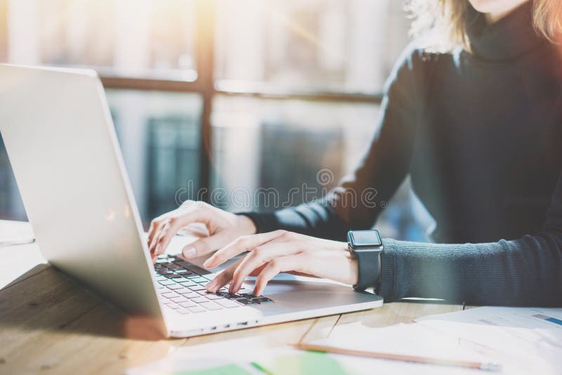 Work Process in Modern Office. Young Account Manager Working at Wood Table with New Business Project.Typing Contemporary royalty free stock photos Work Process in Modern Office. Young Account Manager Working at Wood Table with New Business Project.Typing Contemporary royalty free stock photos