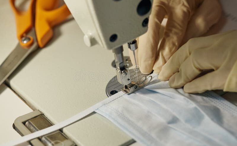 Work process of sewing masks for protection against coronavirus royalty free stock photos