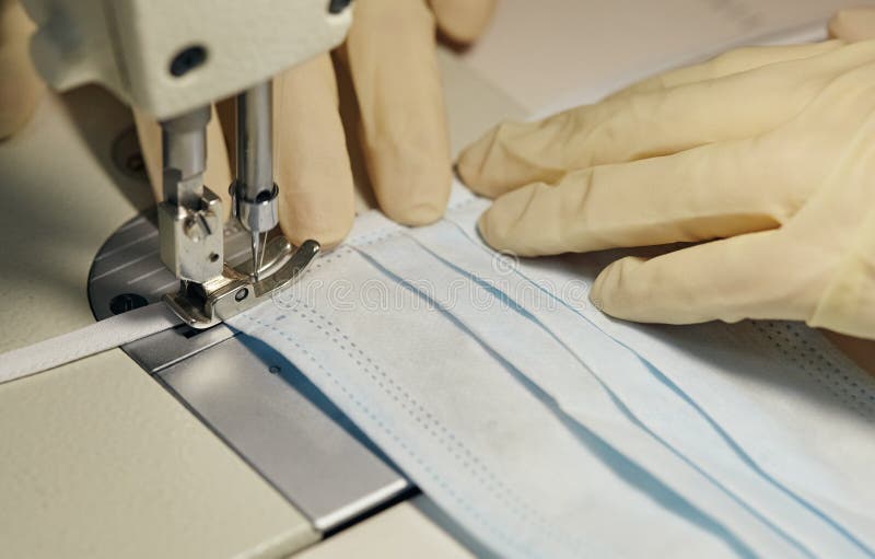 Work process of sewing masks for protection against coronavirus royalty free stock photography