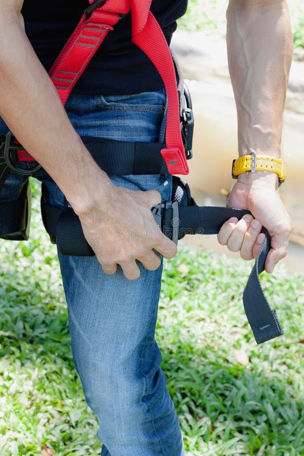 Soft focus close up young man Asian wear the safety harness for job at height stock photo Soft focus close up young man Asian wear the safety harness for job at height stock photo