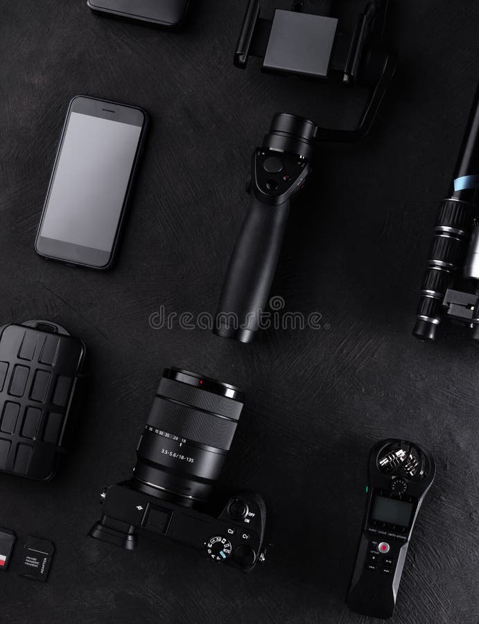 Work Space Videographer with Laptop, Digital Camera, Memory Card, Action Camera, Drone, Remote