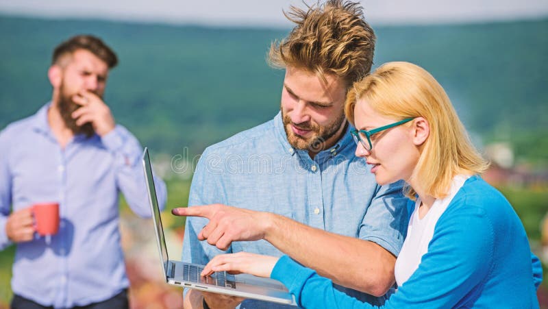 Workaholics concept. Colleagues with laptop work outdoor sunny day, nature background. Couple works despite of coffee